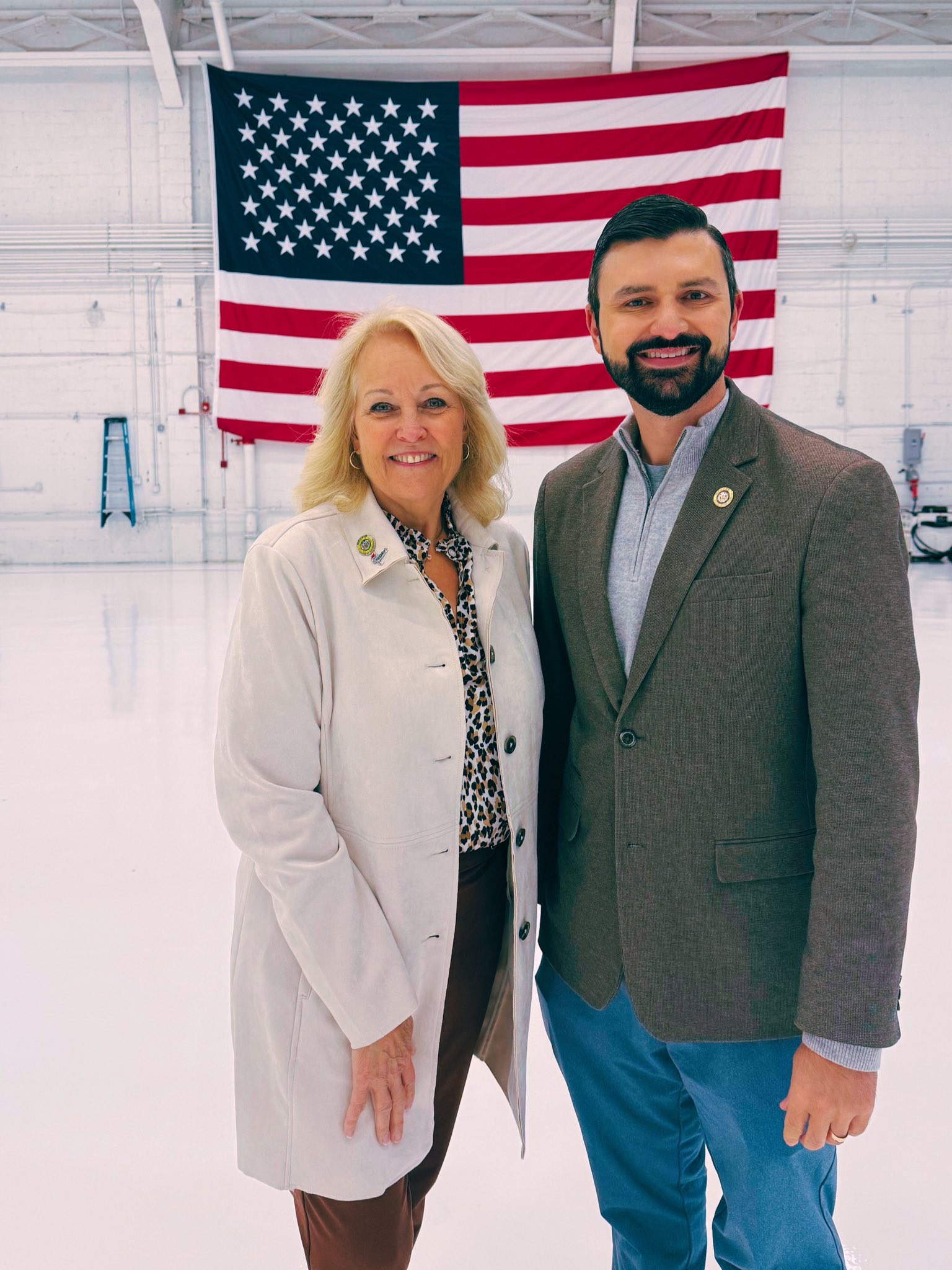 Delegate Nawrocki at Martin State Airport in front of the American flag